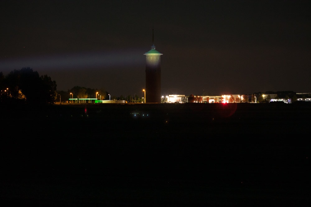 beamshots at night with tower