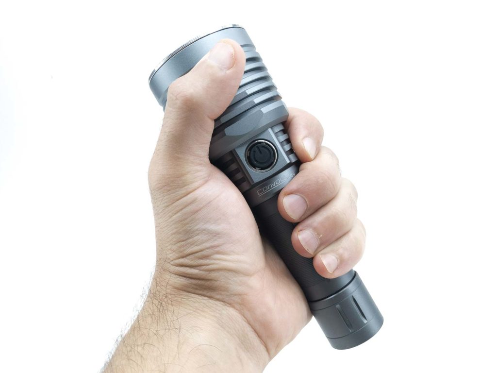 holding a grey flashlight