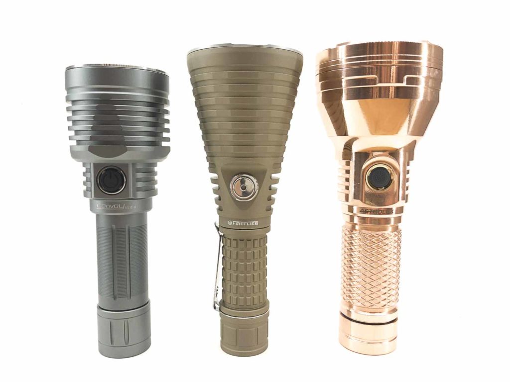 Fireflies T9R tan color next to Astrolux copper and Convoy flashlight