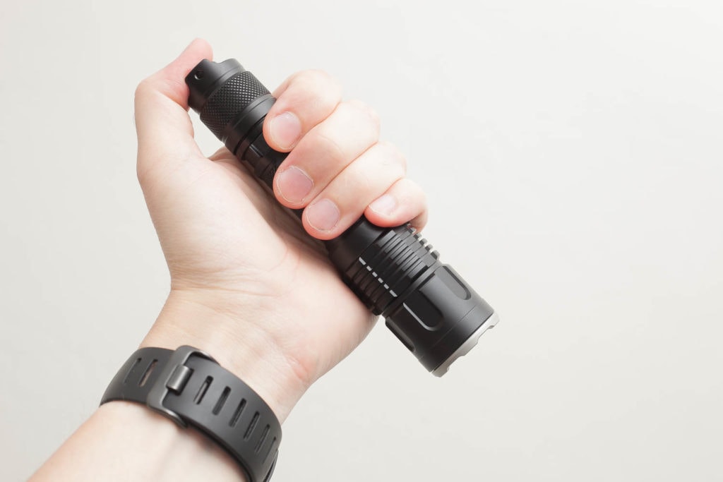 Jetbeam flashlight holding in tactical position