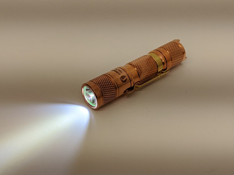 lumintop copper flashlight turned on