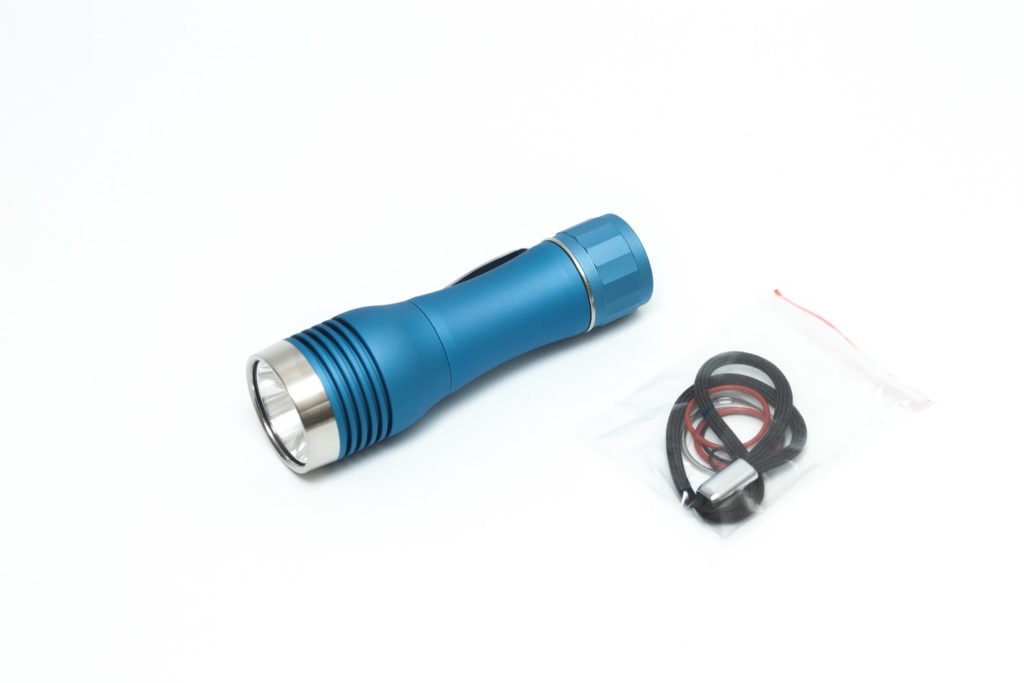 cyan flashlight with accessories