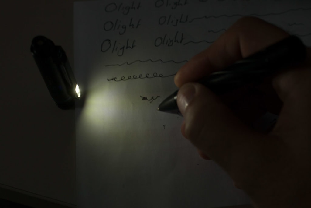 pen writing in dark