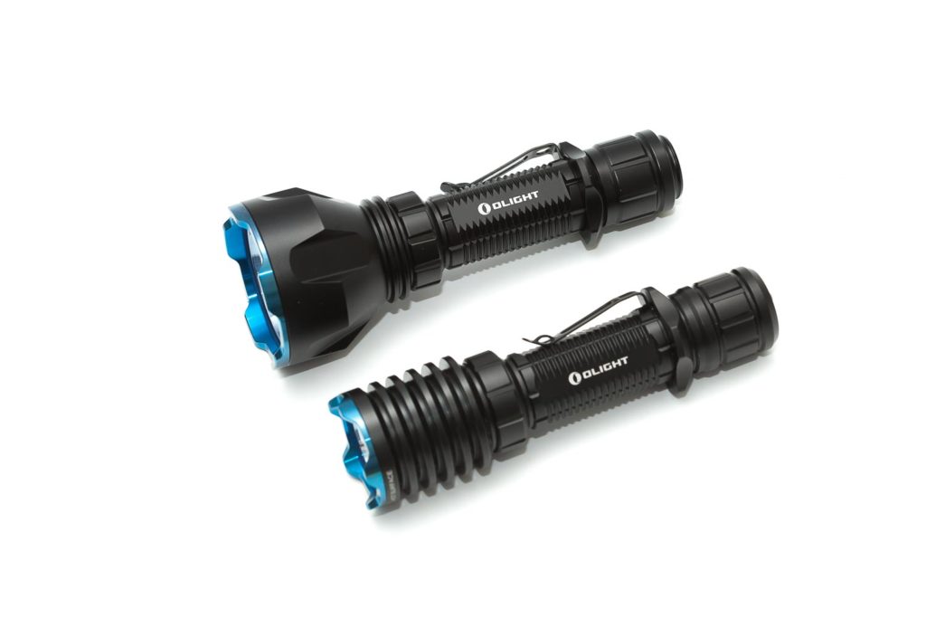 2 Olight flashlights next to each other